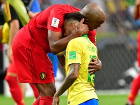 Belgium's defender Vincent Kompany greets Brazil's forward Neymar after Belgium won the Russia 2018 World Cup quarter-final football match between Brazil and Belgium at the Kazan Arena in Kazan on July 6, 2018.