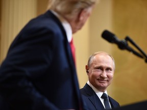 U.S. President Donald Trump and Russia's President Vladimir Putin attend a joint press conference after a meeting at the Presidential Palace in Helsinki, on July 16, 2018.