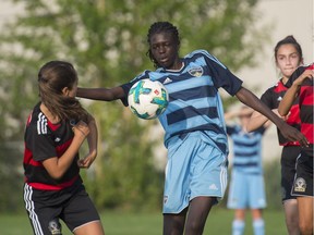 Alout Agar, centre, has been named to the U15 National soccer team.