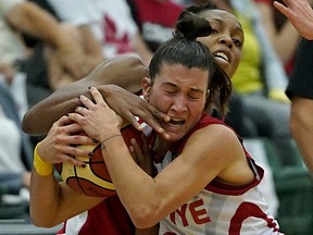 Team Canada's Nirra Fields and Team Turkey's Asena Yalcin (front) battle for the ball during game action in the first game of the 2018 Edmonton Grads International Classic basketball tournament held at the Saville Community Sports Centre in Edmonton on July 4, 2018. The three-game series, from July 4 to 7, will see the Canadian Women's National Basketball Team, ranked 5th in the world, square-off against the 7th-ranked Turkish Women's National Basketball Team. Both Canada and Turkey will participate in the 2018 FIBA World Championship for Women, held in Spain at the end of September. (PHOTO BY LARRY WONG/POSTMEDIA)