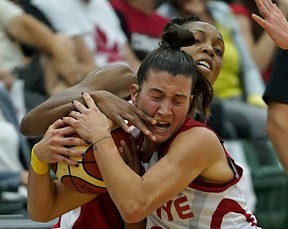 Team Canada's Nirra Fields and Team Turkey's Asena Yalcin (front) battle for the ball during game action in the first game of the 2018 Edmonton Grads International Classic basketball tournament held at the Saville Community Sports Centre in Edmonton on July 4, 2018. The three-game series, from July 4 to 7, will see the Canadian Women's National Basketball Team, ranked 5th in the world, square-off against the 7th-ranked Turkish Women's National Basketball Team. Both Canada and Turkey will participate in the 2018 FIBA World Championship for Women, held in Spain at the end of September. (PHOTO BY LARRY WONG/POSTMEDIA)