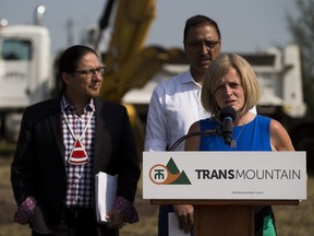 Enoch Cree Nation Chief Billy Morin, left, Premier Rachel Notley, and Natural Resources Minister Amarjeet Sohi take part in a groundbreaking ceremony at the Enoch Cree stockpile site on July 27, 2018.