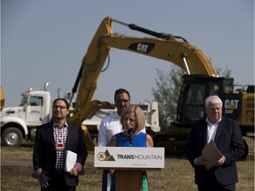 Enoch Cree Nation Chief Billy Morin, Kinder Morgan president Ian Anderson, Premier Rachel Notley, and Natural Resources Minister Amarjeet Sohi take part in the groundbreaking ceremony at the Enoch Cree stockpile site on Friday, July 27, 2018.