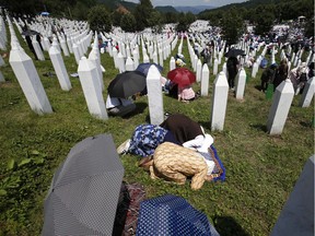 Bosnian Muslim women pray during a funeral ceremony for the victims of the 1995 massacre, at the memorial centre of Potocari near Srebrenica, Bosnia, on July 11, 2018. Thousands of Bosnian Muslims have gathered in Srebrenica to mark the 23rd anniversary of Europe's worst massacre since the Second World War to hold prayers and attend the funeral for 35 recently identified victims.