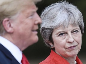 British Prime Minister Theresa May and U.S President Donald Trump hold a joint press conference at Chequers, in Buckinghamshire, England, Friday, July 13, 2018.