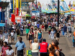 The midway is packed at K Days in Edmonton on Saturday, July 28, 2018.