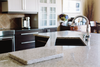 Modern countertops — whatever the variety of material used — should be seamless with a substantial beveled edging.