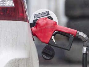 A gas pump is shown at a filling station in Montreal. An online price monitoring firm says gasoline prices in Canada have spiked at the highest average price ever recorded thanks mainly to a 17-cent increase in the price per litre of regular fuel in Calgary.