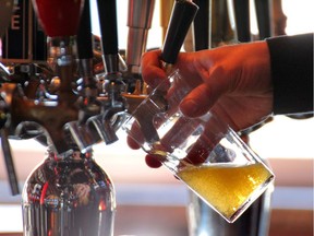 Pouring a glass of beer in Melrose on 17 ave s.w. in Calgary, Alberta, on February 2, 2012.