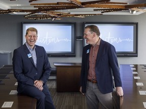 ATB Financial incoming CEO Curtis Stange, left, and outgoing CEO Dave Mowat are pictured at ATB Financial offices in Edmonton on Friday June 29, 2018.THE CANADIAN PRESS/Jason Franson