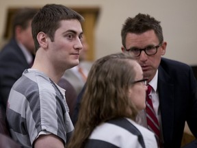 Sarah Elaine Mitchell, right, and Travis Lee Mitchell, the parents of a twin girl who struggled to breath after a home birth, appear in court in Oregon City, Ore., Monday, July 9, 2018. The couple, members of the Followers of Christ Church, that shuns traditional medicine in favour of prayer and anointing the sick with oils, have pleaded guilty to negligent homicide in the death of their premature daughter.