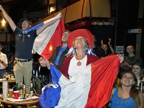 Soccer fans celebrate Team France's victory over Team Croatia at La Cite Francophone in Edmonton, Canada on Sunday July 15, 2018. France defeated Croatia by a score of 4-2 at the 2018 World Cup soccer final in Moscow, Russia on Sunday July 15, 2018. (PHOTO BY LARRY WONG/POSTMEDIA)