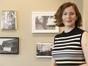 Coun. Sarah Hamilton poses with historical photos of her ward in her office in Edmonton on June 15, 2018.