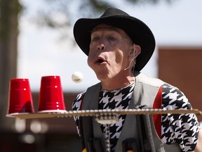 King Pong, a.k.a. Michael Trautman, performs a snippet of his act during the 2018 Edmonton International Street Performers Festival launch at Dr. Wilbert McIntyre Park in Edmonton, on Monday, July 9, 2018.