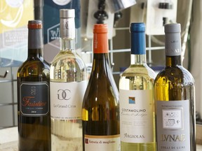 Vermentino wines are seen on a barrel at Color de Vino in Edmonton, on Wednesday, July 11, 2018. Photo by Ian Kucerak/Postmedia