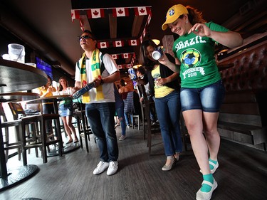 Brazilian soccer fans dance and sing at the Urban Tavern, 11606 Jasper Avenue, following the team's World Cup win Monday July 2, 2018. David Bloom/Postmedia