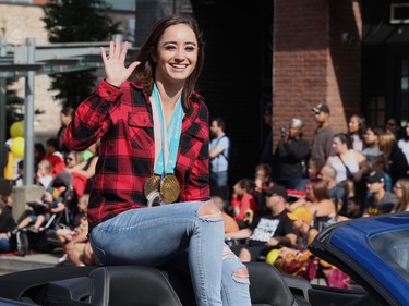 Parade Marshal and Olympic medalist Kaetlyn Osmond waves to the crowd at  the K-Days parade in downtown Edmonton on July 20, 2018.