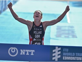 Great Britain's Vicky Holland crosses the finishline to win the Elite Women event during the ITU World Triathlon at Hawrelak Park in Edmonton, July 27, 2018.