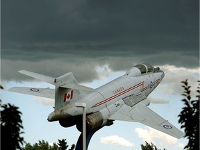 A CF-101 Voodoo jet appears to be flying through a sudden rain storm that descended upon downtown Edmonton on Saturday July 7, 2018. The aircraft is on display at the Alberta Aviation Museum.