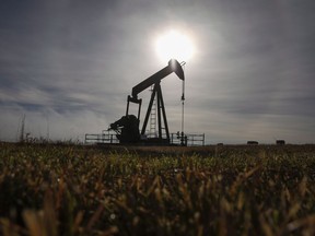 A pumpjack works at a well head on an oil and gas installation near Cremona, Alta., Saturday, Oct. 29, 2016. New technologies employing brute force as well as artificial volcanic action are being developed to better seal thousands of inactive oil and gas wells in Canada that are leaking methane, a greenhouse gas with an outsized impact on global warming.