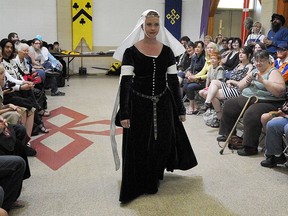 Carrie Paton takes part in a fashion show during the Knights of the Northern Realm's Second Annual Medieval May at Ritchie Community Hall in Edmonton on May 27, 2012.