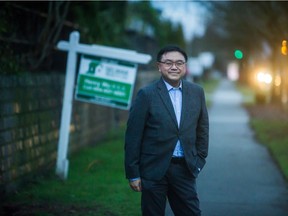 SFU researcher Andy Yan stands along East Broadway in Vancouver, BC, January 8, 2018.