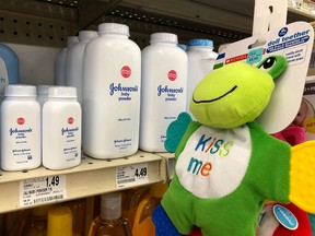 Containers of Johnson's baby powder made by Johnson and Johnson are displayed on a shelf on July 13, 2018 in San Francisco, California. A Missouri jury has ordered pharmaceutical company Johnson and Johnson to pay $4.69 billion in damages to 22 women who claim that they got ovarian cancer from Johnson's baby powder.