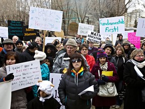 Protesters gather during a rally to support a petition calling for math curriculum reform at the Alberta legislature in 2014.