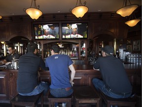 Hockey fans watch the Edmonton Oilers hockey game at Hudsons on Whyte, 10307 Whyte Ave., in Edmonton Alta. on Saturday Oct. 10, 2015. The bar, as well as Nyala's lounge, were fined after being charged for overcrowding incidents in 2017.