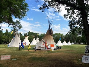 Teepees that were set up in protest across from the Saskatchewan legislature are staying put. The protest camp is seen near the provincial legislature in Regina on Tuesday, July 3, 2018.