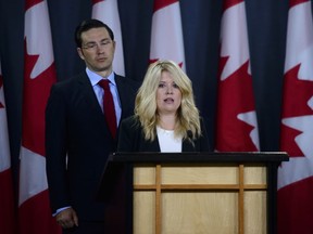Conservative MPss Michelle Rempel, shadow Minister for Immigration, Refugees, and Citizenship, and Pierre Poilievre, shadow Minister for Finance, hold a press conference at the National Press Theatre in Ottawa on Tuesday, July 24, 2018.
