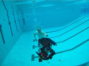 The sub is lowered into the water to Ryan van Drecht who swam beside to ensure it was working properly and not leaking. A University  of Alberta team of electrical, mechanical and software engineering students built the robotic submarine Auri 2.0. It was designed to navigate an underwater obstacle course at the RoboSub Competition in San Diego July 30. It was revealed at the Van Vliet pool on July 7, 2018. Shaughn Butts / Postmedia