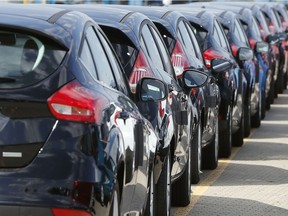 In this July 21, 2017, file photo, Ford cars wait for deployment after arrival by ship at the Ford Dagenham diesel engine plant in London.