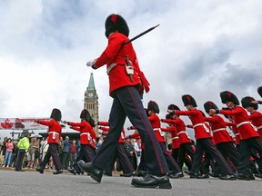 This file photo show the Ceremonial Guard leaving Parliament Hill.