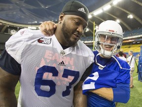 Montreal Alouettes newest quarterback Johnny Manziel, right, leaves the field with Tony Washington, also acquired in the same trade, after the team's practice at Olympic Stadium Monday, July 23, 2018 in Montreal.