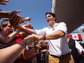 Prime Minister Justin Trudeau greets revellers during Canada Day festivities in Leamington Ont. Sunday, July 1, 2018.