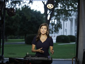 CNN White House correspondent Kaitlan Collins talks during a live shot in front of the White House, Wednesday, July 25, 2018, in Washington.