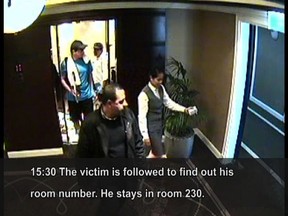 An image grab taken on February 16, 2010 from hotel surveillance camera footage, released by Dubai police, allegedly shows two murder suspects dressed as tourists in tennis outfits, following Hamas militant Mahmud al-Mabhuh (front), before he was found dead in his hotel room in Dubai on January 20, 2010.