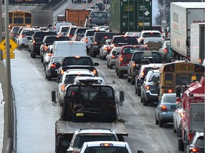 Traffic tie ups due to a collision along Whitemud Dr. westbound on the Rainbow Valley Bridge as some snow fell and the winds blew to create a wind chilling day in Edmonton, Monday, December 5, 2016.