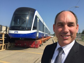 Bombardier Transportation president Benoit Brossoit celebrates the arrival of the first light rail train for the new Valley Line in Edmonton July 27, 2018.