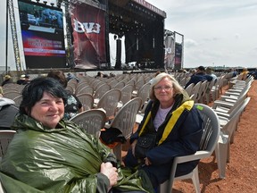 Jackie Hunt, left, of Red Deer and Kathleen Zimmerman of Winfield were not too thrilled about the seat changes due to the altered stage setup on Friday, Aug. 3, 2018 at Big Valley Jamboree in Camrose.