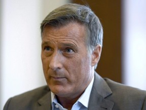 Conservative MP Maxime Bernier participates in an interview with The Canadian Press in his office on Parliament Hill in Ottawa on Wednesday, Aug. 1, 2018.