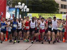 Racers leave the start line at the Edmonton Marathon on Aug. 20, 2017, in Edmonton.