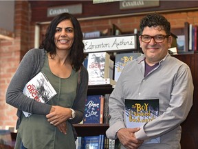 Local authors Neena H. Brar, left, and Ben Sures, holding their latest books being released shortly in Edmonton, on Wednesday, Aug. 29, 2018.