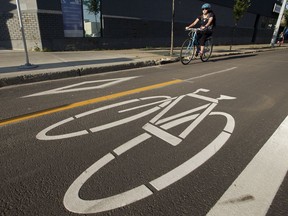 A cyclist rides in a bike lane east along 102 Avenue between 109 Street and 108 Street, in Edmonton. File photo.