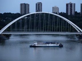 The Edmonton Riverboat (formerly The Edmonton Queen) makes its way along the North Saskatchewan River past the Walterdale Bridge, in Edmonton Tuesday July 31, 2018. Photo by David Bloom