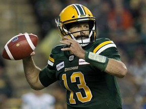 Edmonton Eskimos quarterback Mike Reilly battles the Saskatchewan Roughriders during CFL action at Commonwealth Stadium on Aug. 2, 2018.