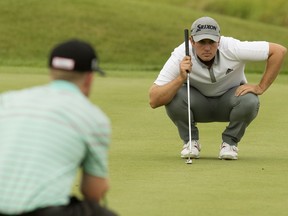 George Cunningham (right) and Matt Marshall line up their shot on the 9th hole during the third round of the Syncrude Oil Country Championships at the Edmonton Petroleum Golf Club, in Edmonton Saturday Aug. 4, 2018. Photo by David Bloom