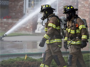 Firefighters battle a fire at a home on Wolf Willow Point, in Edmonton Sunday Aug. 5, 2018. Photo by David Bloom