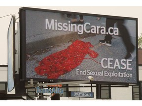 Kathy King has put up a billboard in central Edmonton which she hopes will raise awareness about her daughter's murder as well as spark tips about the many unsolved cases of missing and murdered local women, Wednesday Aug. 15, 2018. Photo by David Bloom